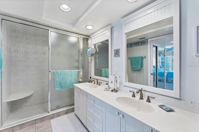 7554 Palm Island Dr S Unit 1822, Placida, FL 33946 - ensuite bathroom featuring a stall shower, ensuite bath, double vanity, and a sink