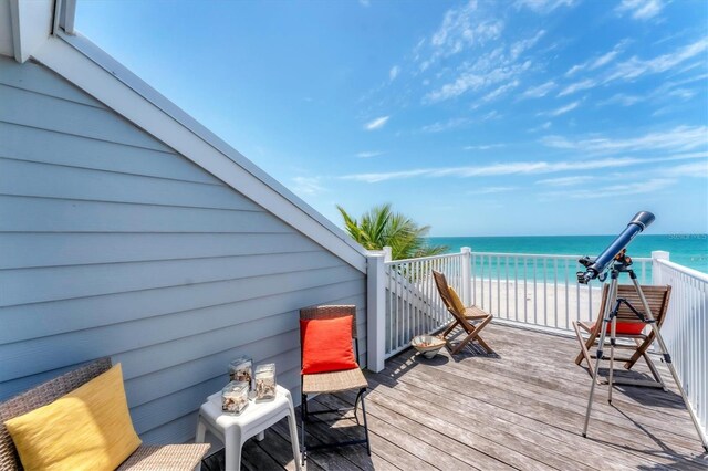 7554 Palm Island Dr S Unit 1822, Placida, FL 33946 - wooden deck with a water view and a view of the beach