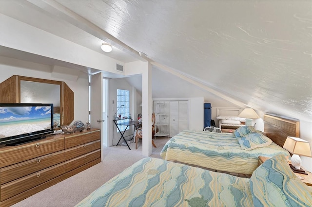 7554 Palm Island Dr S Unit 1822, Placida, FL 33946 - carpeted bedroom featuring vaulted ceiling, a closet, and visible vents
