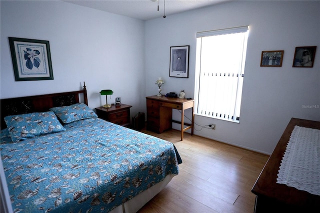 bedroom featuring wood finished floors