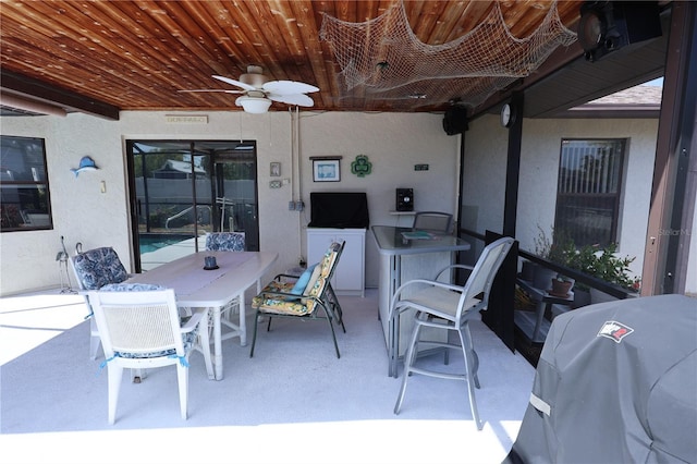 view of patio with a grill, visible vents, ceiling fan, and outdoor dining area