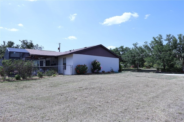 view of property exterior featuring fence and stucco siding