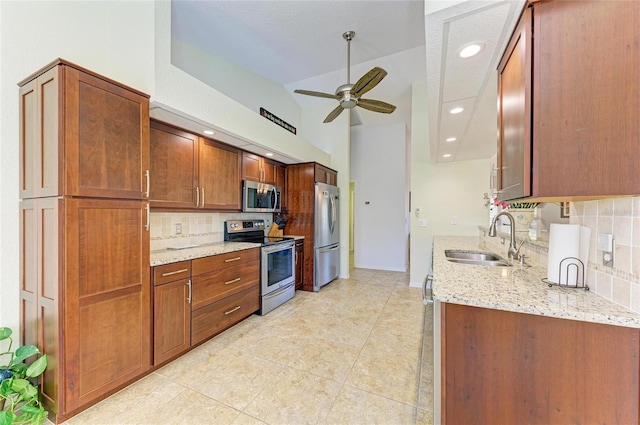 68 Long Meadow Ln, Rotonda West, FL 33947 - kitchen featuring stainless steel appliances, a ceiling fan, a sink, and backsplash