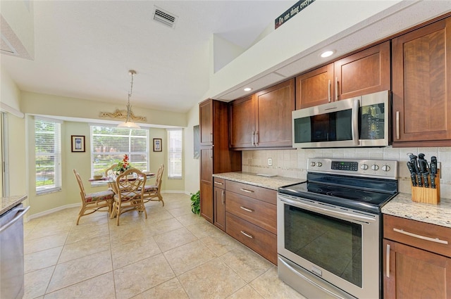 68 Long Meadow Ln, Rotonda West, FL 33947 - kitchen with backsplash, visible vents, appliances with stainless steel finishes, and baseboards