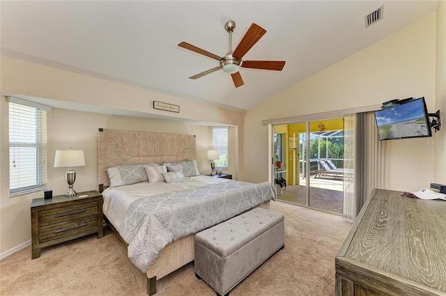 68 Long Meadow Ln, Rotonda West, FL 33947 - bedroom featuring vaulted ceiling, visible vents, light colored carpet, and access to outside