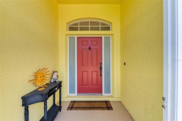 68 Long Meadow Ln, Rotonda West, FL 33947 - property entrance with stucco siding