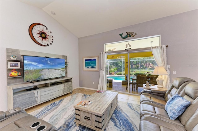 68 Long Meadow Ln, Rotonda West, FL 33947 - living area featuring lofted ceiling, tile patterned flooring, and baseboards