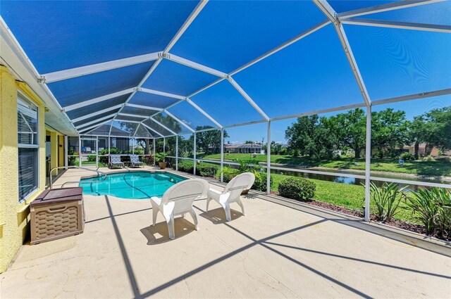 68 Long Meadow Ln, Rotonda West, FL 33947 - pool with a water view, a patio area, and glass enclosure