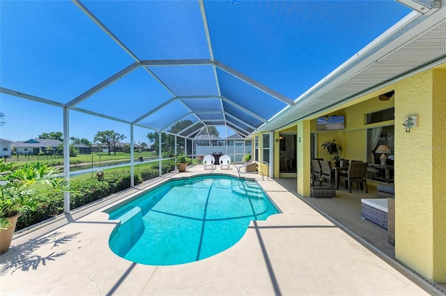 68 Long Meadow Ln, Rotonda West, FL 33947 - view of pool featuring glass enclosure, a patio area, and a fenced in pool