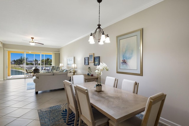 8500 Amberjack Cir Unit 102, Englewood, FL 34224 - dining room with ornamental molding, light tile patterned flooring, and ceiling fan with notable chandelier