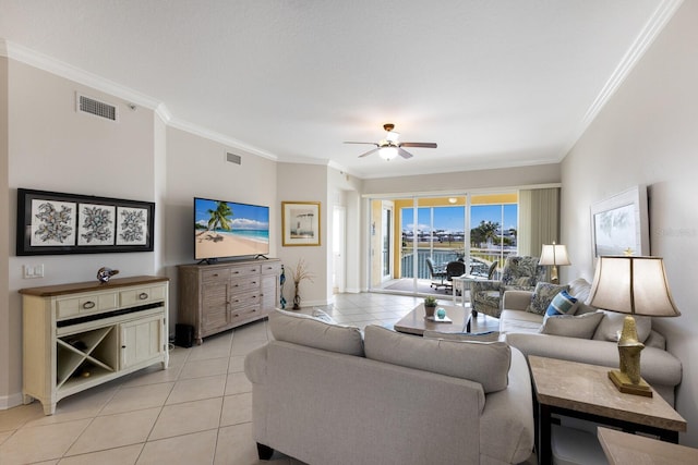 8500 Amberjack Cir Unit 102, Englewood, FL 34224 - living room with ceiling fan, ornamental molding, light tile patterned flooring, and visible vents