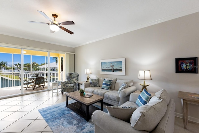8500 Amberjack Cir Unit 102, Englewood, FL 34224 - living room featuring crown molding, a ceiling fan, and light tile patterned floors