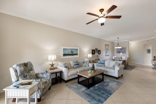 8500 Amberjack Cir Unit 102, Englewood, FL 34224 - living area featuring baseboards, crown molding, ceiling fan with notable chandelier, and light tile patterned floors