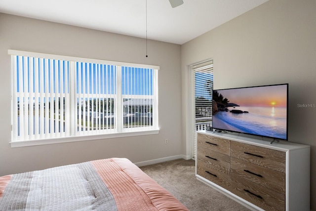 8500 Amberjack Cir Unit 102, Englewood, FL 34224 - bedroom featuring a ceiling fan, baseboards, and light colored carpet