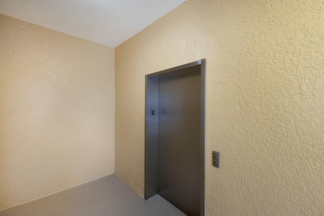8500 Amberjack Cir Unit 102, Englewood, FL 34224 - doorway to property with elevator and stucco siding