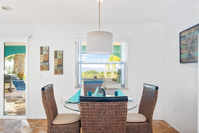 dining space featuring tile patterned floors