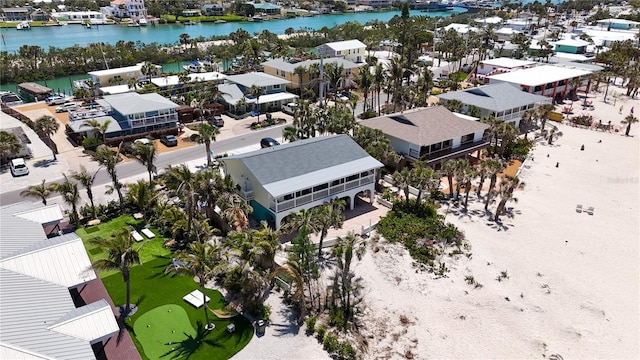 drone / aerial view with a water view and a residential view