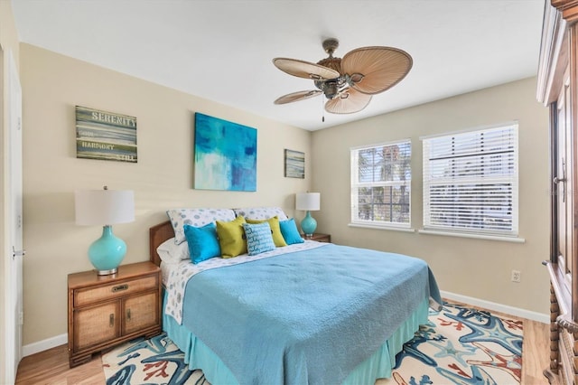 7470 Palm Island Dr Unit 2813, Placida, FL 33946 - bedroom with wood finished floors, a ceiling fan, and baseboards
