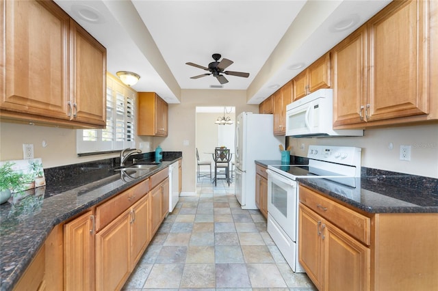 39 Bunker Pl, Rotonda West, FL 33947 - kitchen with brown cabinets, dark stone countertops, a sink, white appliances, and ceiling fan with notable chandelier