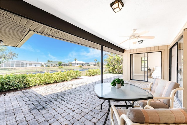 39 Bunker Pl, Rotonda West, FL 33947 - view of patio with a ceiling fan and a residential view