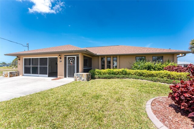 39 Bunker Pl, Rotonda West, FL 33947 - single story home featuring stucco siding and a front lawn