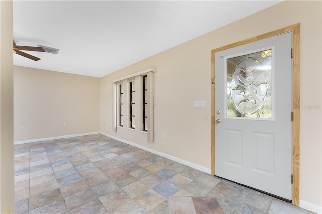 39 Bunker Pl, Rotonda West, FL 33947 - foyer with stone finish flooring, a ceiling fan, and baseboards