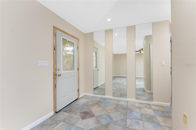 39 Bunker Pl, Rotonda West, FL 33947 - entryway with baseboards, recessed lighting, ceiling fan, and stone finish flooring