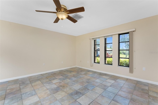 39 Bunker Pl, Rotonda West, FL 33947 - spare room with stone finish flooring, baseboards, ceiling fan, and visible vents