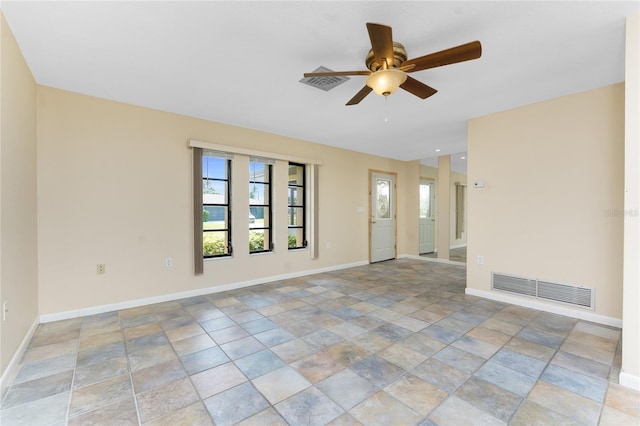 39 Bunker Pl, Rotonda West, FL 33947 - spare room with stone finish flooring, baseboards, ceiling fan, and visible vents