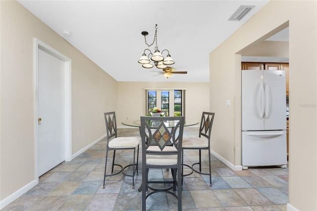 39 Bunker Pl, Rotonda West, FL 33947 - dining space featuring baseboards, visible vents, stone finish flooring, and an inviting chandelier
