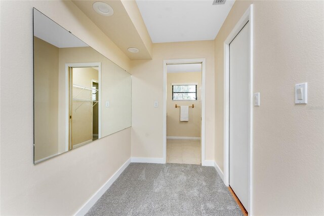 39 Bunker Pl, Rotonda West, FL 33947 - hallway with baseboards and carpet