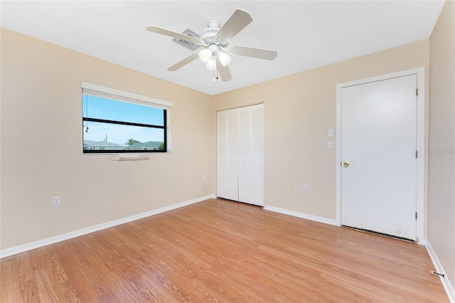 39 Bunker Pl, Rotonda West, FL 33947 - unfurnished bedroom featuring baseboards, a ceiling fan, light wood-style floors, and a closet