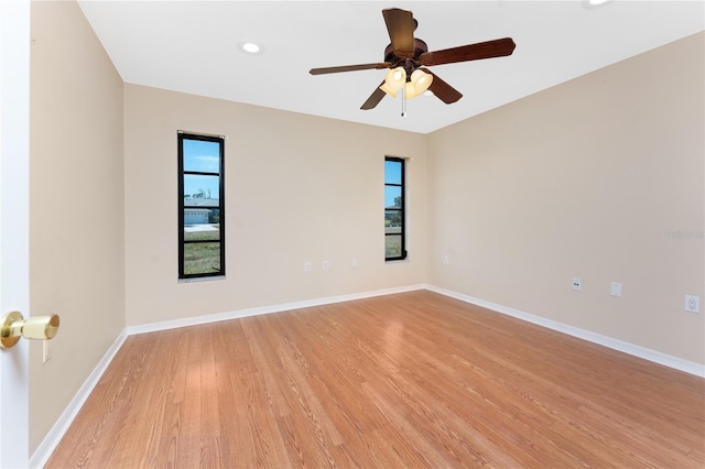 39 Bunker Pl, Rotonda West, FL 33947 - unfurnished room with a healthy amount of sunlight, light wood finished floors, and a ceiling fan