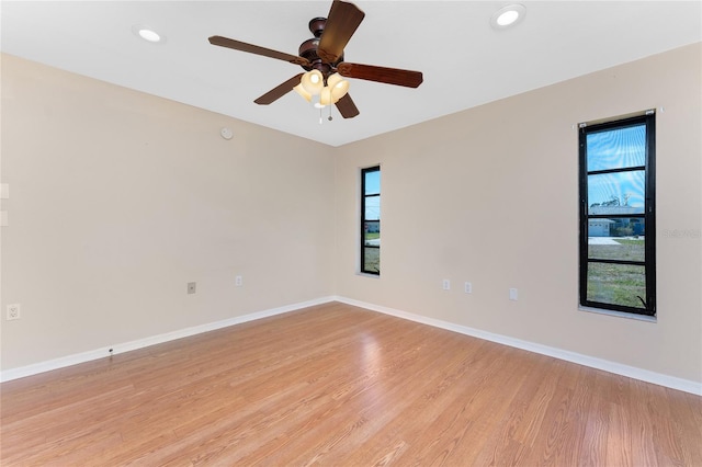 39 Bunker Pl, Rotonda West, FL 33947 - empty room featuring light wood-style flooring, baseboards, recessed lighting, and ceiling fan