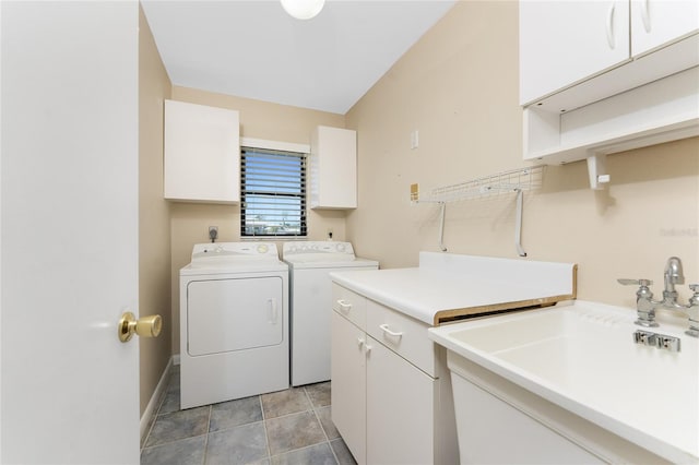 39 Bunker Pl, Rotonda West, FL 33947 - laundry area with washing machine and dryer, baseboards, cabinet space, and a sink