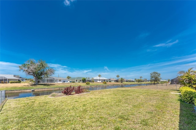 39 Bunker Pl, Rotonda West, FL 33947 - view of yard with fence, a residential view, and a water view