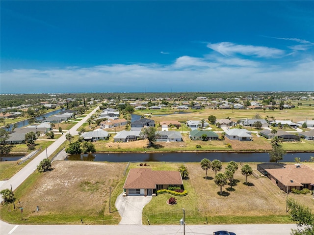 39 Bunker Pl, Rotonda West, FL 33947 - drone / aerial view featuring a water view and a residential view