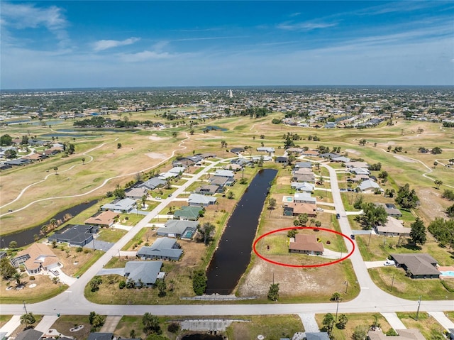 39 Bunker Pl, Rotonda West, FL 33947 - bird's eye view with view of golf course, a water view, and a residential view
