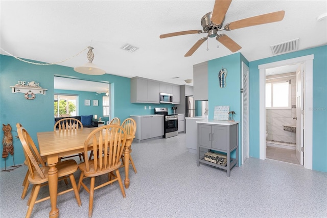 1245 Gulf Blvd, Englewood, FL 34223 - dining area featuring visible vents and a ceiling fan