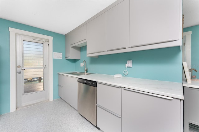 1245 Gulf Blvd, Englewood, FL 34223 - kitchen with stainless steel dishwasher, gray cabinets, a sink, and light countertops