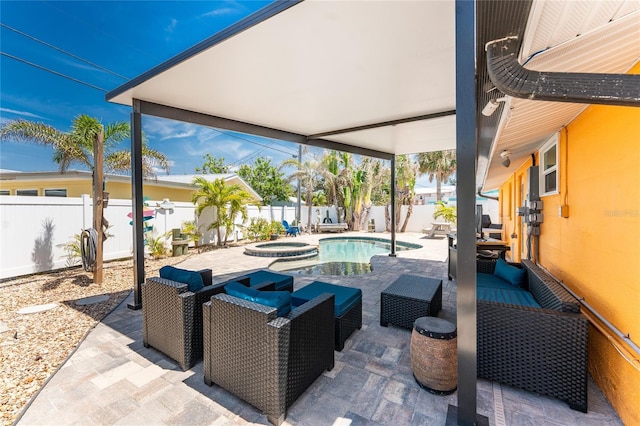 1245 Gulf Blvd, Englewood, FL 34223 - view of swimming pool featuring a patio, a pool with connected hot tub, an outdoor living space, and a fenced backyard