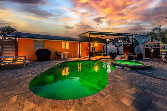 1245 Gulf Blvd, Englewood, FL 34223 - view of pool with a patio, an outbuilding, a pool with connected hot tub, and a storage shed