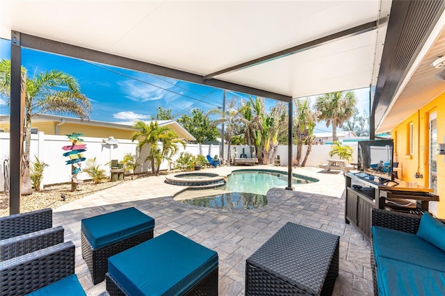 1245 Gulf Blvd, Englewood, FL 34223 - view of patio / terrace with a pool with connected hot tub, a fenced backyard, and an outdoor hangout area