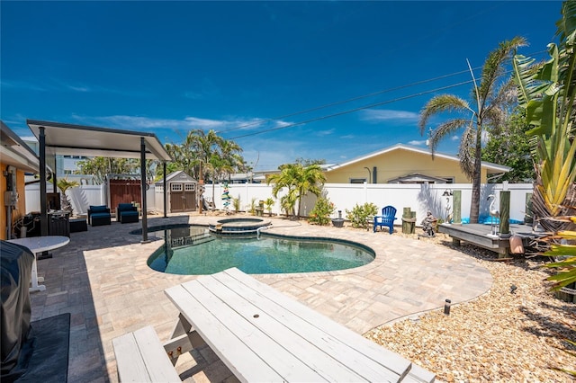 1245 Gulf Blvd, Englewood, FL 34223 - view of swimming pool with a fenced backyard, a storage unit, an outbuilding, and a patio area
