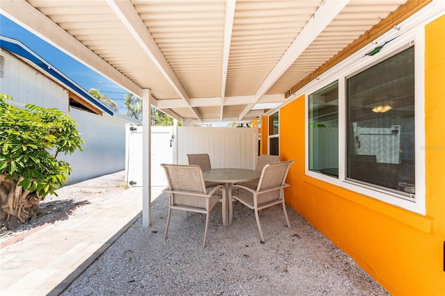 1245 Gulf Blvd, Englewood, FL 34223 - view of patio with fence and outdoor dining space