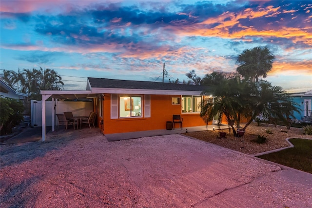 1245 Gulf Blvd, Englewood, FL 34223 - view of front facade with driveway and an attached carport