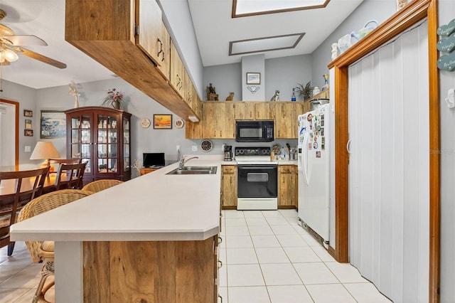 kitchen with white refrigerator with ice dispenser, electric range oven, black microwave, light countertops, and light tile patterned floors