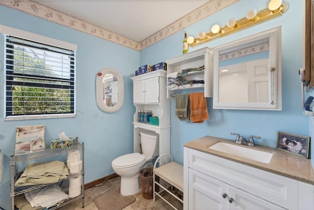 bathroom with toilet and vanity