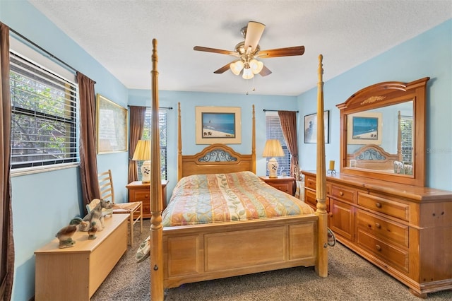 bedroom with ceiling fan, a textured ceiling, and carpet