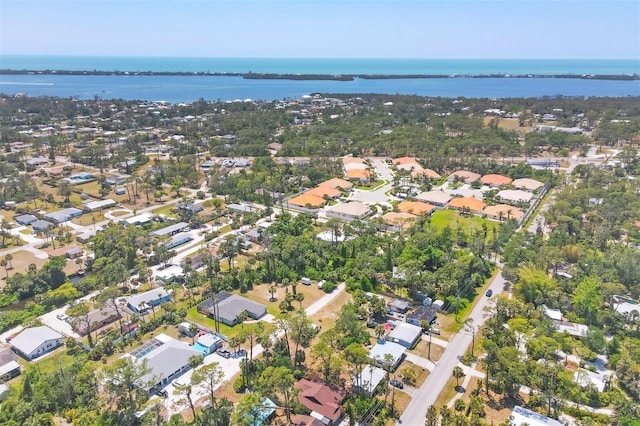 drone / aerial view featuring a residential view and a water view